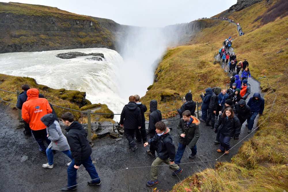 Tourists at Gullfoss waterfall, one of Iceland's many spectacular sights. (Thomas Nilsen / The Independent Barents Observer)