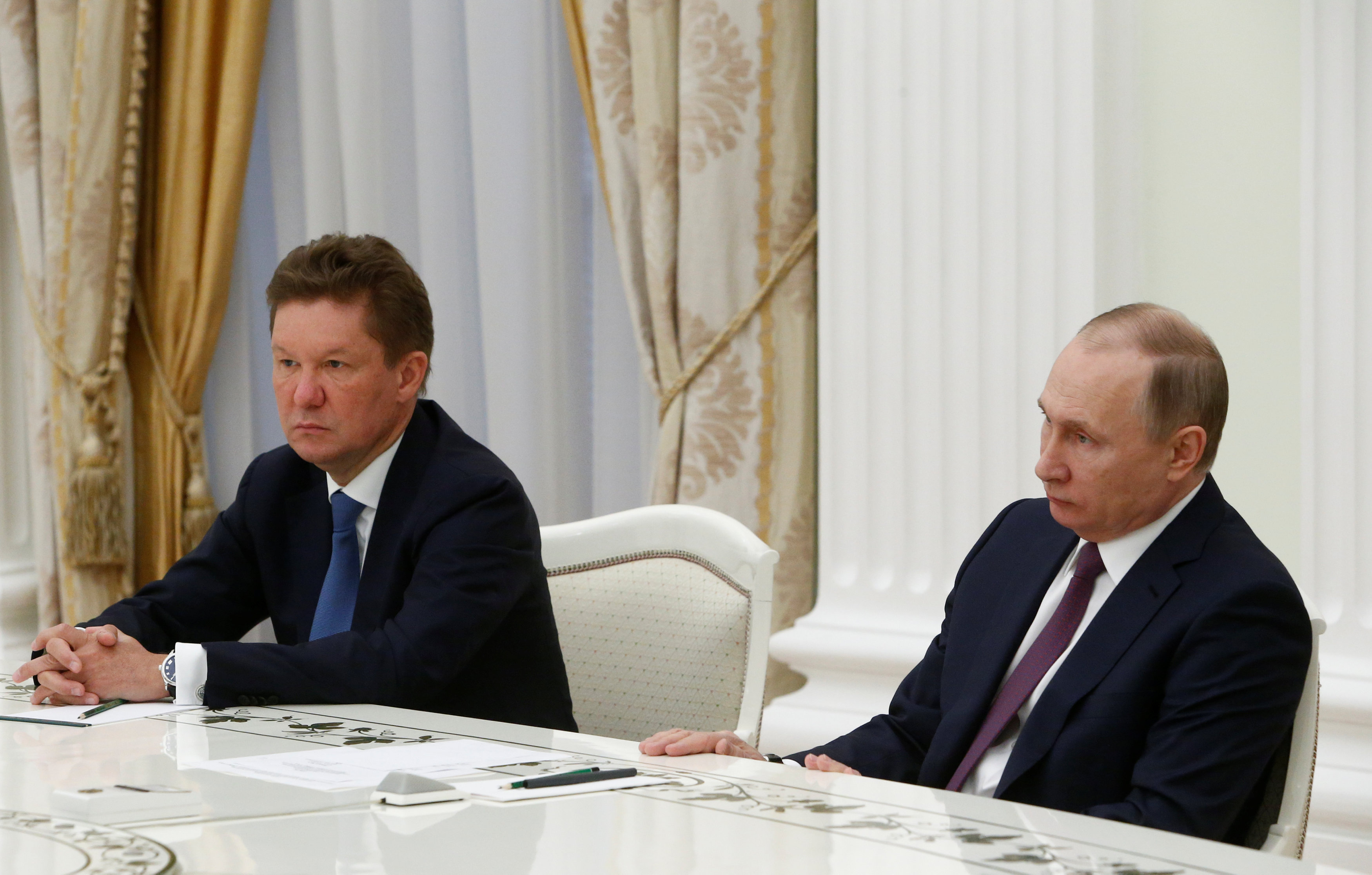 Russia's President Vladimir Putin (R) and Russian state gas company Gazprom Chief Executive Officer Alexei Miller attend a meeting with Austrian oil and gas group OMV Chief Executive Officer Rainer Seele (not pictured) at the Kremlin in Moscow, Russia April 28, 2017. (Sergei Karpukhin / Reuters)